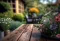 Wooden table place for an object in the garden with flowers. Royalty Free Stock Photo