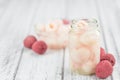 Wooden table with Preserved Lychees selective focus