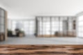 Wooden table for product display with blurred empty office hall on background Royalty Free Stock Photo