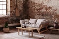 Wooden table on rug in front of beige couch in apartment interior in wabi sabi style with red brick wall