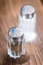 Wooden table with Salt and Pepper Shaker Royalty Free Stock Photo