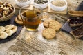 Wooden table set for a sweet vegan breakfast with tea, sliced banana, mixed dried fruit, vegan biscuits, slices of bread with jam Royalty Free Stock Photo