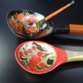 Wooden table spoons on a black background