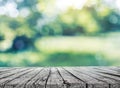 Wooden table and spring blurred background Royalty Free Stock Photo