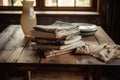 a wooden table with a stack of books and a beautiful napkin in the middle