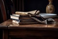 a wooden table with a stack of books and a beautiful napkin in the middle