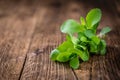 Wooden table with Stevia leaves (selective focus)