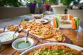 wooden table on the street in a cafe with food, Outdoor terrace concept of a buffet table, catering. Royalty Free Stock Photo