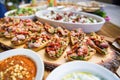 wooden table on the street in a cafe with food, Outdoor terrace concept of a buffet table, catering. Royalty Free Stock Photo