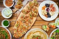 wooden table on the street in a cafe with food, Outdoor terrace concept of a buffet table, catering. Royalty Free Stock Photo