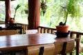 Wooden table on terrace balcony near garden