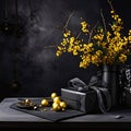 Wooden table top, Black gift with Cocard, golden baubles and dry yellow flowers, black background.Valentine\'s Day banner Royalty Free Stock Photo