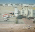 Wooden table top with blur of aircraft and loading area Royalty Free Stock Photo