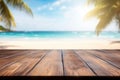 Wooden table top on blur tropical beach background - can be used for display or montage your products Royalty Free Stock Photo