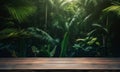 Wooden table top on blur tropical forest background with bokeh light Royalty Free Stock Photo