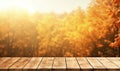 Wooden table top on blurred autumn forest background. Perfect for display or montage your products Royalty Free Stock Photo