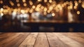 Photo of a wooden table top with blurry lights in the background Royalty Free Stock Photo
