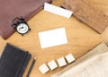 Wooden Table top with clock,type box,notebook,leather bag and p Royalty Free Stock Photo