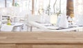 Wooden table top on defocused restaurant background with set tables Royalty Free Stock Photo