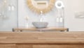 Wooden table top in front of blurred bathroom interior background Royalty Free Stock Photo