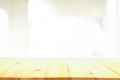 Wooden table top in front of blurred bedroom interior background Royalty Free Stock Photo