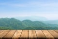 Wooden table top with nature mountain and forest blurred background. Copy space for your display or montage product design Royalty Free Stock Photo