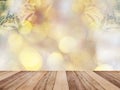 Wooden table top over abstract Christmas background with  ornament decoration and golden bokeh Royalty Free Stock Photo