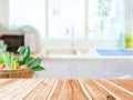 Wooden table top over blurred kitchen interior with copy space Royalty Free Stock Photo