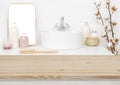 Wooden table top for product display and blurred bathroom background Royalty Free Stock Photo