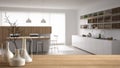 Wooden table top or shelf with minimalistic modern vases over blurred minimalistic kitchen with island and stools, modern architec