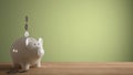 Wooden table top or shelf with white piggy bank with coins, saving money for future investments, concept idea with green colored Royalty Free Stock Photo