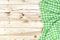 Wooden table, top view, green checkered tablecloth