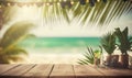 a wooden table topped with glasses and a vase filled with flowers next to a palm tree on a beach with a view of the ocean Royalty Free Stock Photo