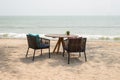 Wooden table with two chairs at beach restaurant Royalty Free Stock Photo