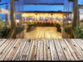 wooden table with a view of blurred beverages bar backdrop, empty table to showcase your product, against the background of a Royalty Free Stock Photo