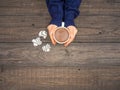 Women`s hands hold a mug with hot cocoa