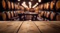 Wooden table with Wine barrels in wine-vaults in order on background