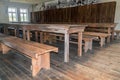 Wooden tables and benches inside prison barack at the former Nazi Germany Concentration Camp Gross-Rosen