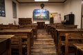 wooden tables and chairs in classroom