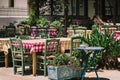 Wooden tables with green chairs at traditional Greek cafe Royalty Free Stock Photo