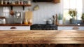 Wooden tabletop against blurred kitchen background for product mockups and display montages.