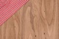 wooden tabletop and checked tablecloth Royalty Free Stock Photo