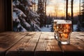 A Wooden Tabletop With Glass Of Beer Against Backdrop Of Winter Lodge Blank Surface