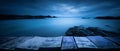 A wooden tabletop product display with a spooky coast background