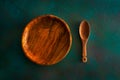 Wooden tableware on grungy green