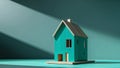 wooden teal house model on a black background. Royalty Free Stock Photo