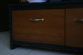 Wooden television table with multiple curtains