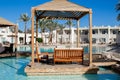 Wooden terrace close landscape with relaxing benches on the beautiful hotel`s territory of Reef Oasis Beach Resort 5