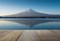 Wooden terrace and mount fuji in the early morning with reflection