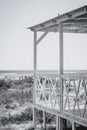 Wooden terrace next to the beach with clear sea wooden fences of the house on the beach. black and white image. the Royalty Free Stock Photo